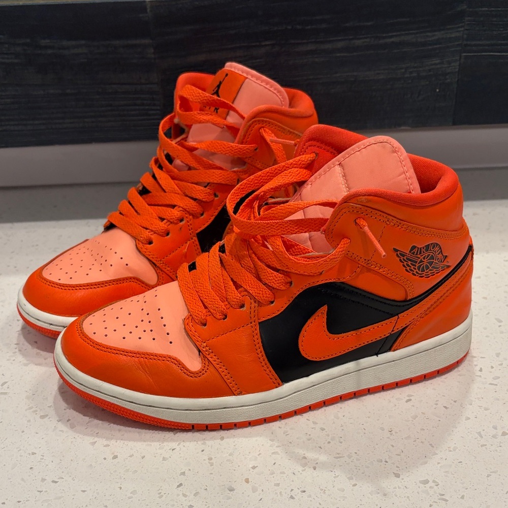 Air Jordan Rush Orange and Black Mid Sneakers